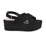 Sandalias de plataforma color beige con tiras cruzadas y hebilla ajustable en el tobillo.