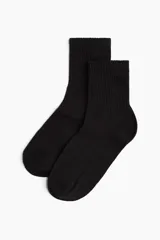 Pack de tres pares de medias de caña media color negro, de punto fino suave con caña acanalada y borde superior elástico.