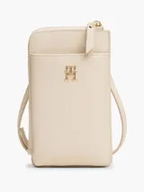 Cartera para móvil Tommy Hilfiger color beige con correa ajustable, cierre de cremallera, bolsillo exterior para el móvil, bolsillo interior con cremallera y múltiples ranuras interiores para tarjetas.