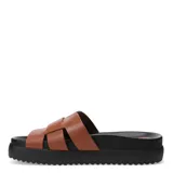 Sandalias negras de mujer, estilo slide, con plataforma gruesa y suela dentada. La capellada presenta un diseño trenzado o tejido con tiras anchas de cuero.