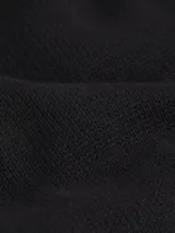 Sweater negro de punto de algodón suave, con cuello alto, corte relaxed, puños y bajo de canalé, y logo CK bordado en el pecho.