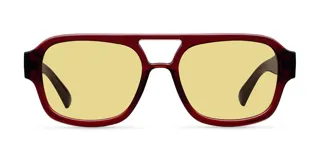 Lentes de sol de aviador oversize con montura marrón y lentes amarillas.