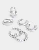 Set de tres pares de aros argolla chunky plateados, de diferentes diseños.