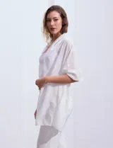 Pashmina de gasa color blanco con apliques de brillos.