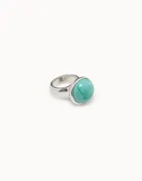 Anillo plateado con un cristal de Murano redondo color verde agua.