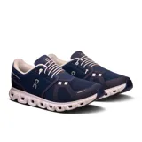 Championes de running azules con detalles en blanco y logo de la marca en el lateral.