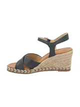 Sandalias negras con tiras cruzadas en el empeine, pulsera con hebilla al tobillo y plataforma de yute.