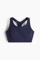 Top deportivo azul marino de tejido funcional con tecnología ShapeMove™ y DryMove™. Ofrece ajuste ceñido, soporte óptimo y absorción de sudor. Cuenta con copas forradas con relleno extraíble, breteles anchos ajustables, espalda nadadora de malla con abertura y cierre de corchetes trasero.