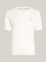 Sweater de algodón blanco con cuello redondo y mangas cortas, con logotipo bordado de Tommy Hilfiger en el pecho.