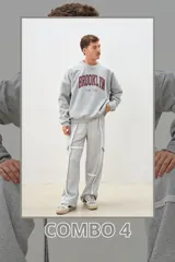 Conjunto gris compuesto por un buzo de algodón con estampa "Brooklyn New York" en color bordó y un pantalón jogger con aberturas en las rodillas y tiras laterales.