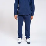 Pantalón de jogging azul con detalles en blanco y logo del Club Nacional de Football.