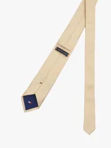 Corbata color beige de pura seda con tejido texturizado.