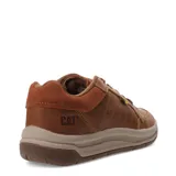 Zapato acordonado de cuero color marrón con detalles en gamuza en el talón. Suela de goma color beige y marrón.