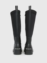 Botas de agua Calvin Klein Jeans negras, de caña alta y suela track. Fabricadas en goma y neopreno.