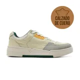 Zapatillas urbanas Hi-Tec Simeon de cuero color crema con detalles en gris y amarillo.