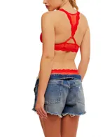 Bralette de malla transparente color celeste con ribete de encaje y espalda cruzada.