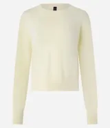 Suéter boxy color marrón, de punto leve, con cuello redondo y mangas largas con puños y bajo acanalados.
