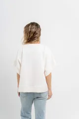 Buzo verde agua de algodón grueso, manga corta y corte oversize.