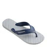 Sandalias Havaianas modelo Track, para hombre, con base blanca y tiras azules con el logo de la marca.