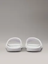 Chancletas blancas Calvin Klein Jeans con logo en relieve en la tira y plantilla texturizada.