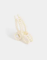 Broche para el pelo con forma de moño y apliques de perlas.