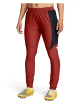 Pantalón deportivo Under Armour Challenger Pro para mujer, color ladrillo con paneles laterales negros y logo blanco.
