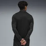 Buzo deportivo negro con cierre 1/4, logo de Puma amarillo en el pecho y escudo del Club Atlético Peñarol.