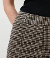 Pantalón legging con estampado pied de poule, cintura elastizada y corte ajustado.