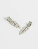 Set de dos hebillas doradas para el pelo con forma de hoja calada.