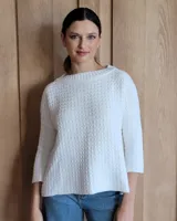 Buzo azul de tejido de punto con cuello redondo y mangas 3/4.