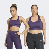 Top deportivo Adidas modelo Powerreact en color violeta, diseñado para entrenamientos de impacto medio. Confeccionado con tecnología CLIMACOOL para mayor transpirabilidad, presenta un cuello cuadrado, espalda deportiva y paneles de malla. Incluye almohadillas removibles y las clásicas tres tiras laterales en contraste.