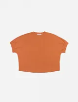 Blusa corta de color naranja con mangas fruncidas y ajuste oversized.