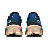 Championes de running On Running Cloudmonster 2, color azul con detalles en gris, negro y beige.