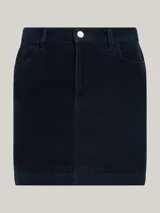 Minifalda de pana azul marino con cierre de cremallera y botón, estilo de cinco bolsillos y logo de Tommy Hilfiger bordado en el bolsillo trasero.