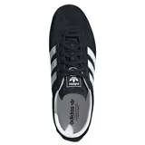 Championes Adidas modelo Gazelle Lo Pro W, color negro con tres franjas laterales blancas y logo dorado. Tienen cordones negros y suela de goma color caramelo translúcida.