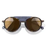 Lentes de sol Sunski Strada con montura redonda de carey, detalles en azul y puente superior de cuero sintético perforado.