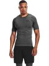 Remera deportiva gris de manga corta Under Armour HeatGear Armour, con logo en el pecho.