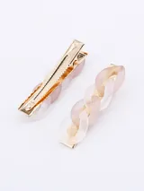 Set de dos broches para el pelo con forma de cadena color crema y detalles dorados.