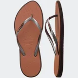 Ojotas Havaianas Slim Point color naranja con borde fucsia y logo fucsia en la tira.