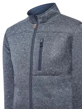 Campera polar color beige jaspeado, con cuello alto, cierre frontal completo y bolsillo vertical con cierre en el pecho.
