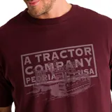 Remera color crema de corte recto y manga corta, con estampa frontal de un tractor y texto en color beige.