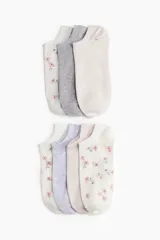 Pack de siete pares de soquetes de algodón en colores lisos y estampados florales.
