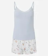 Conjunto de pijama compuesto por musculosa de rib color celeste con breteles finos y encaje en el escote, y short blanco con estampado de amuletos.