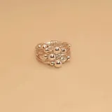 Anillo de plata 925 con diseño de múltiples aros finos unidos y adornados con esferas de diferentes tamaños.