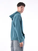 Hoodie gris claro de corte holgado, con capucha y bolsillo tipo canguro. Confeccionado en algodón.