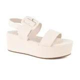 Sandalias de plataforma color hueso, con hebilla cuadrada y tira trasera ajustable.