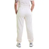 Pantalón deportivo negro de mujer, estilo jogging, con puños elásticos en los tobillos y cordón ajustable en la cintura. Presenta un pequeño logo blanco de Diadora en el muslo derecho.