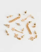 Set de seis pares de aros dorados con diferentes dijes: perlas, manos de Fátima con strass, bolitas, cadenas, estrellas y serpientes.