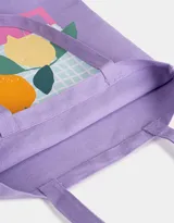 Bolso tote de tela color celeste con estampado de botas de cowboy y texto.