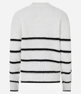 Suéter de punto pesado color negro con rayas horizontales blancas, cuello redondo y mangas largas con sisas desplazadas.